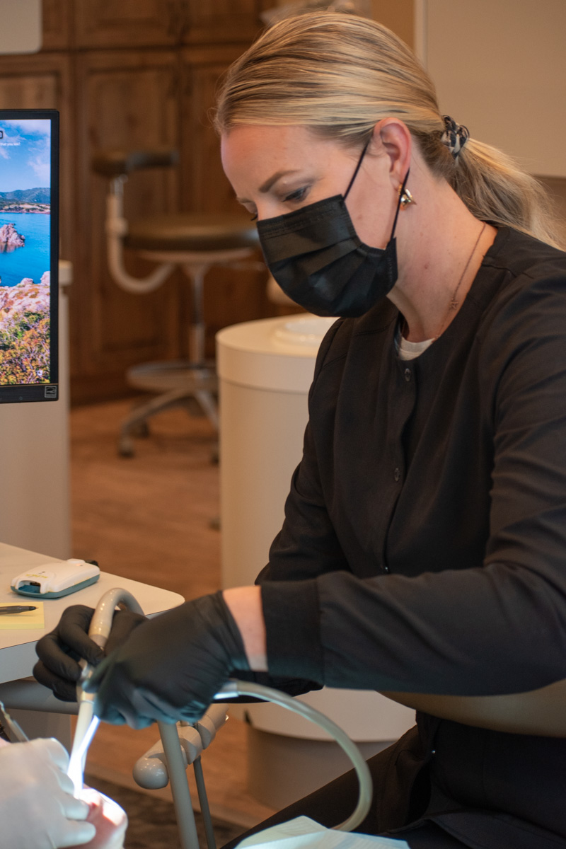 Dentist performing procedure in clinic